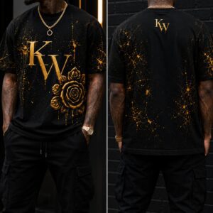 Man modeling black and gold graphic t-shirt.