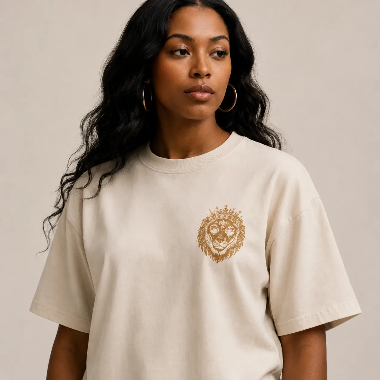 Woman wearing beige lion-printed t-shirt.